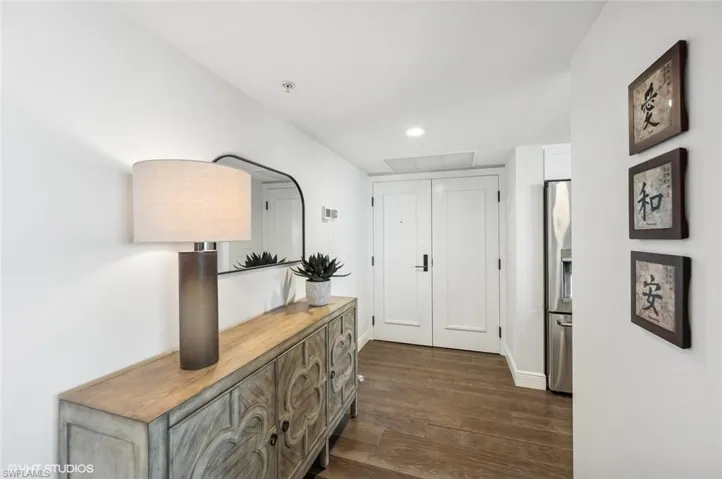 Hallway featuring dark hardwood / wood-style flooring