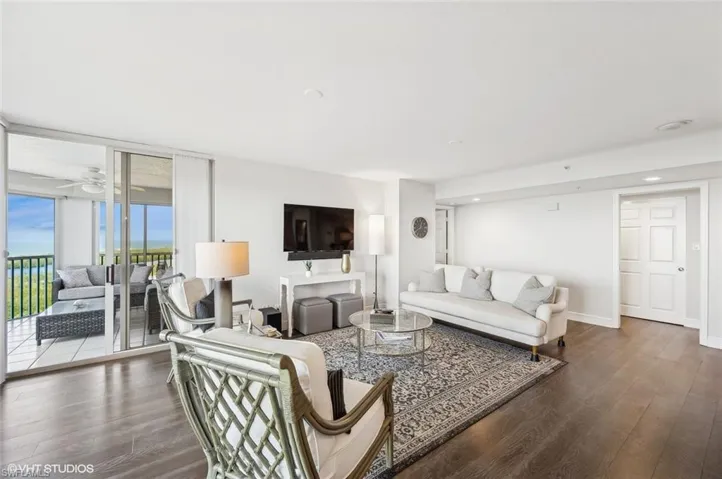 Living room featuring hardwood / wood-style floors and ceiling fan