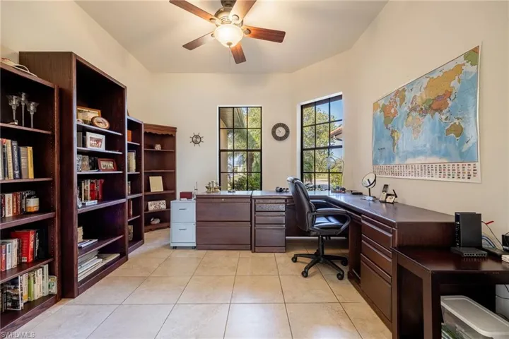 Den/office with doors leading to the family room.