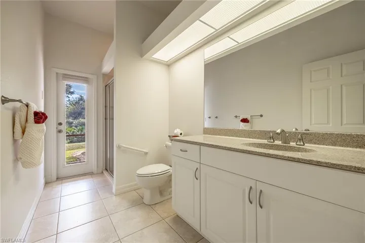 Guest bathroom with pool door.