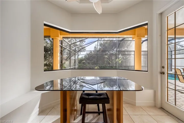 Dining area with bay windows and built-in bench.