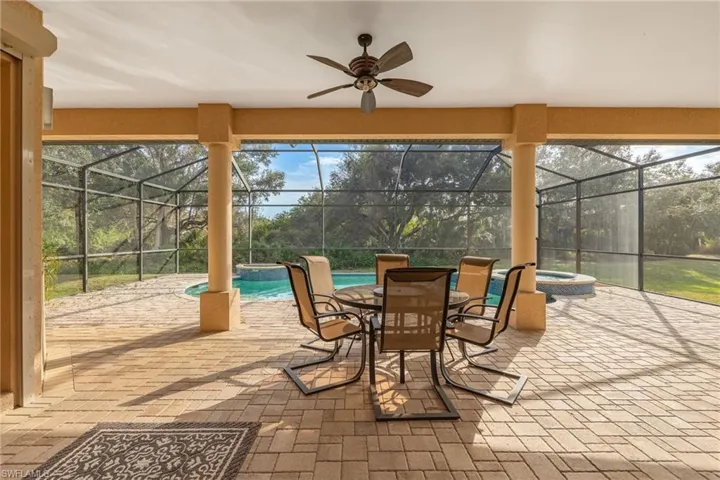 Screened pool lanai with a lot of space for entertaining.