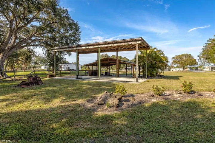 Side view of pole barn and RV carport with electric.