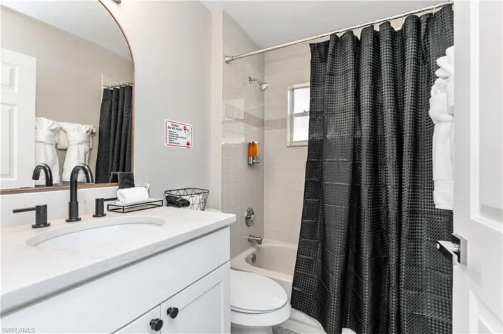 Full bathroom featuring vanity and shower / bath combo