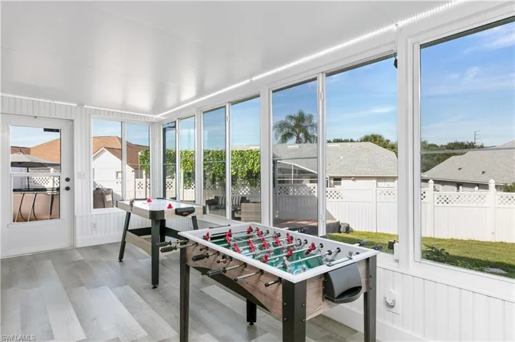Sunroom featuring wood finished floors