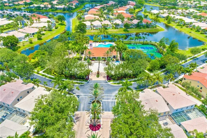 Aerial view of residential area featuring a large body of water