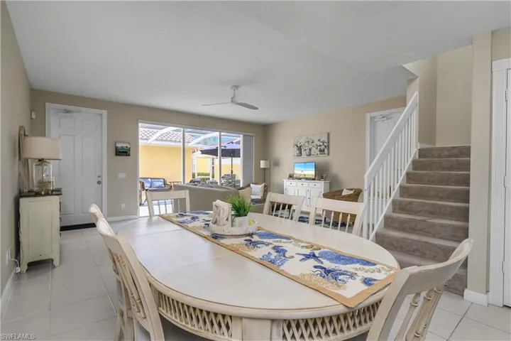Dining room featuring a ceiling fan and light tile patterned floors