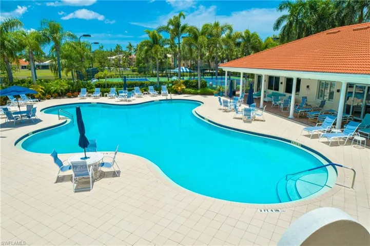 Community pool with a patio area