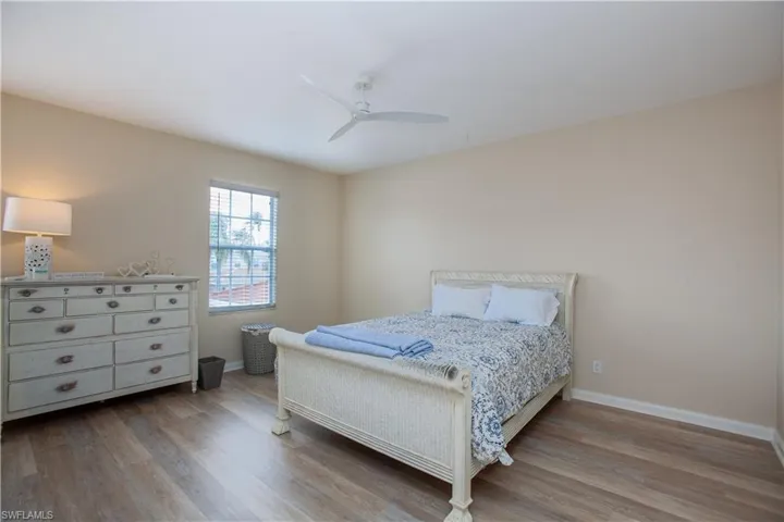 Bedroom with light wood-style floors and ceiling fan