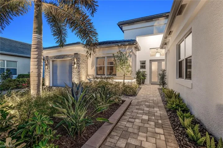 Doorway to property featuring a garage