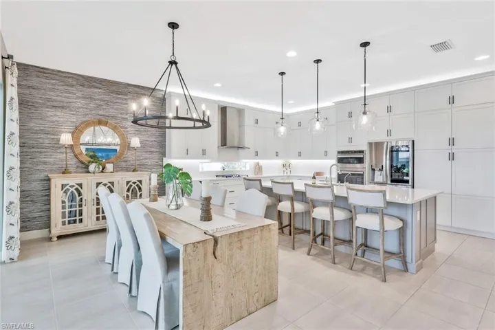 Dining space featuring an inviting chandelier and light tile patterned floors