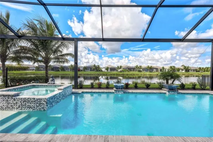 View of swimming pool with panoramic screen enclosure