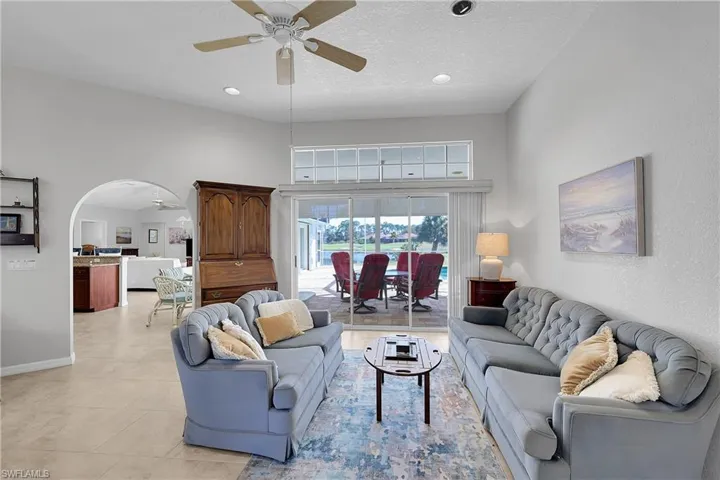 Living area with fabulous pool, lake and golf course (green) views