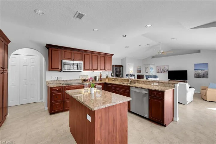 2nd refrigerator in laundry room, double ovens,high speed kettle, pantry and volume ceiling