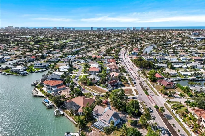 View of property location with a nearby body of water, city skyline, and nearby suburban area