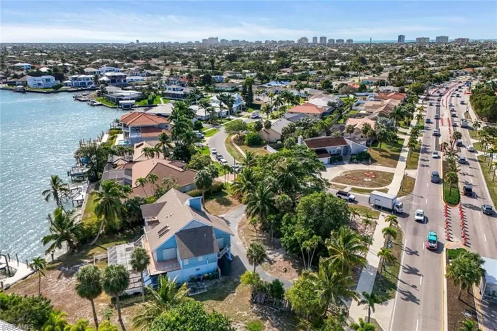 View of property location featuring city skyline and nearby suburban area