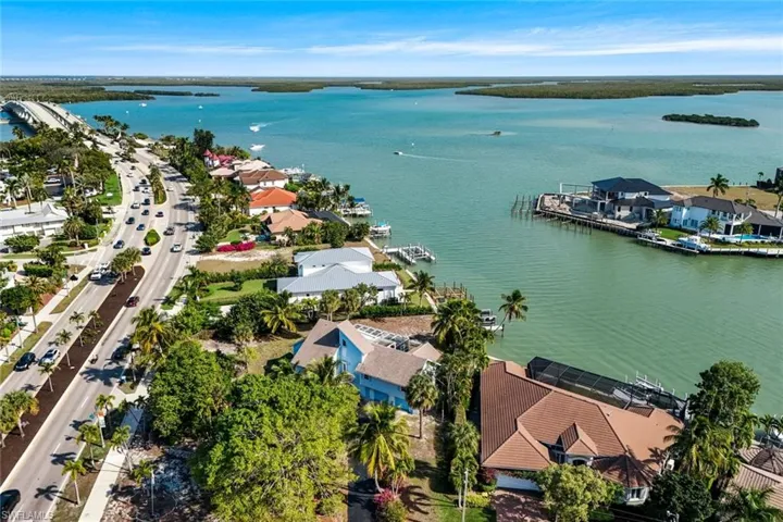 Aerial perspective of suburban area with a large body of water