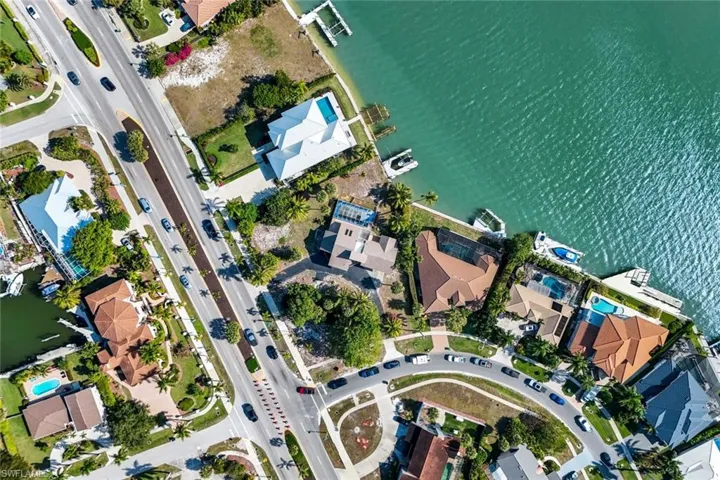View of property location with a large body of water and nearby suburban area