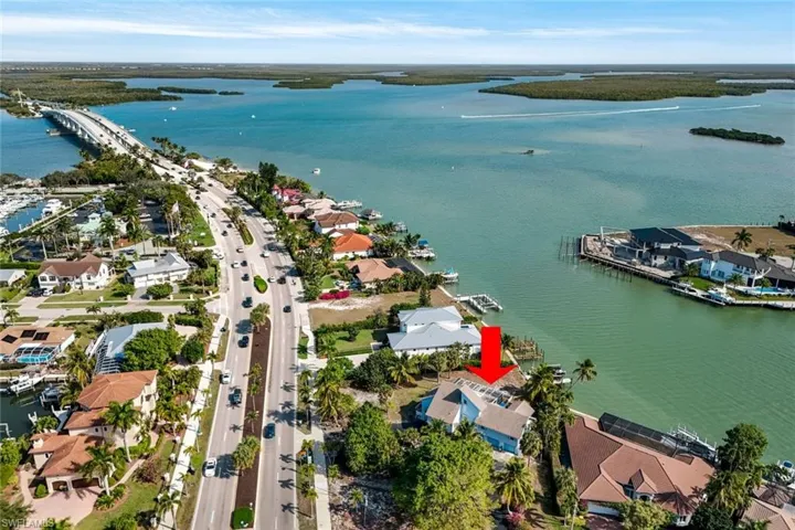 Aerial view of residential area with a large body of water