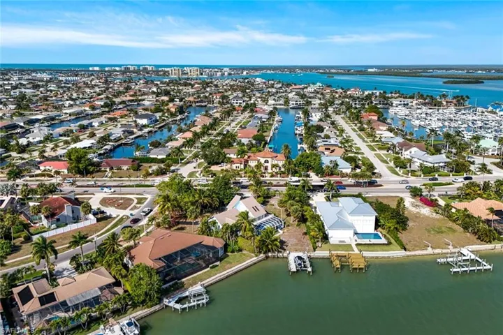 Aerial perspective of suburban area with a large body of water