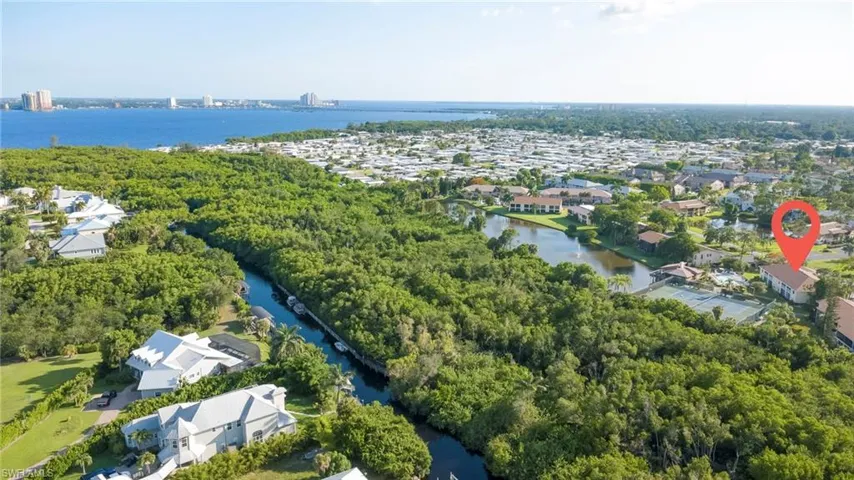 Drone photo of canal, boat dock , downtown Fort Myers in the distance