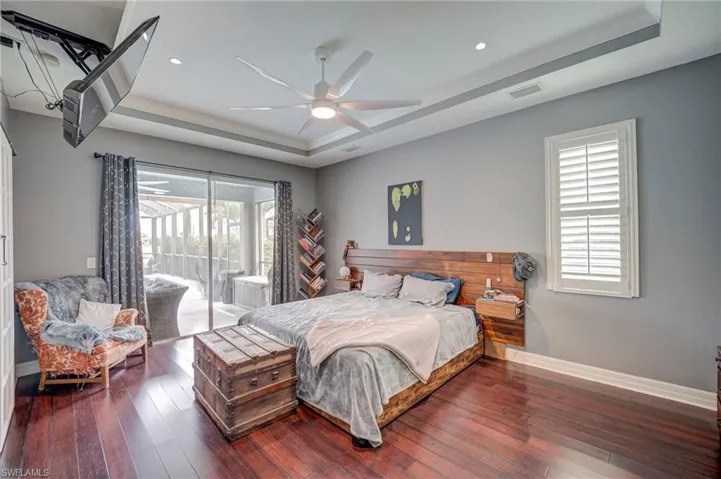 Owner's Suite with Bamboo Flooring, Tray Ceiling, and Plantation Shutters.