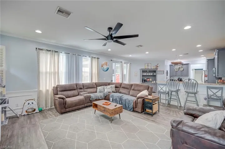 Open Concept to Kitchen that is perfect for entertaining.  Sliders open to Lanai area.