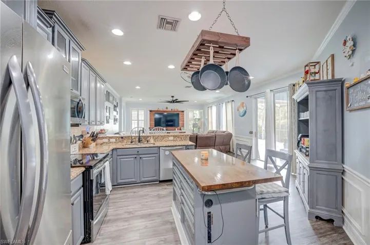 Center Island, Stainless Steel Appliances, Pantry with built-in spice rack