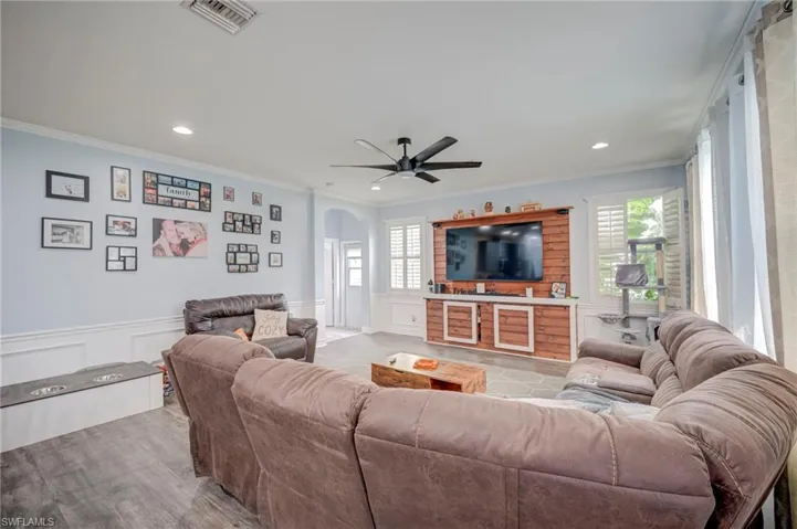 Another view of the Family Room with Entertainment, decorative accent wall for media center.