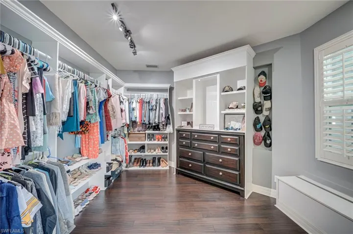 A Walk-in Closet to die for. . .Customized with built-ins.