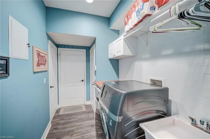 Inside Laundry Room with Laundry Tub.