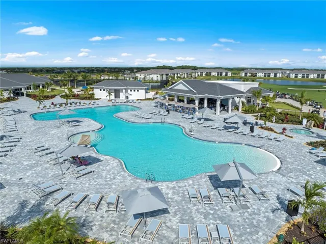 Community pool featuring a patio