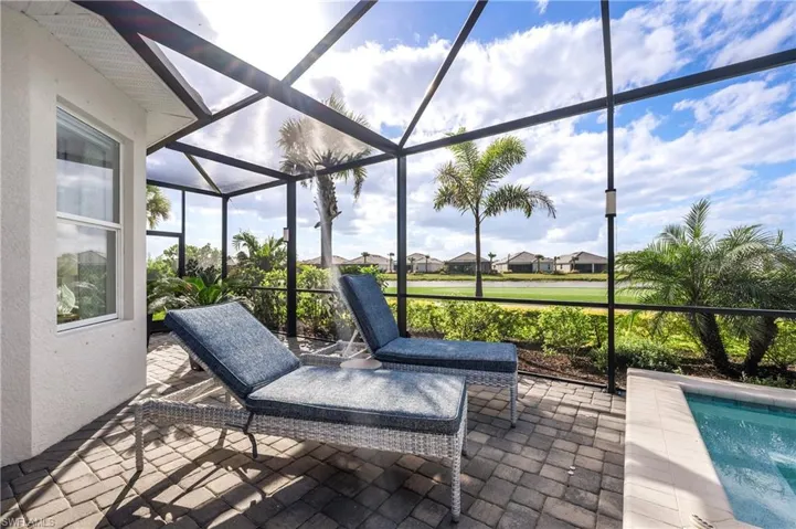 View of patio with glass enclosure