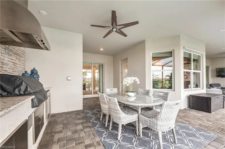 Dining area with ceiling fan and a healthy amount of sunlight