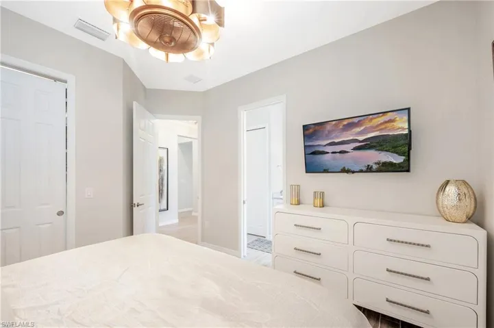 Bedroom featuring light wood-type flooring and ceiling fan
