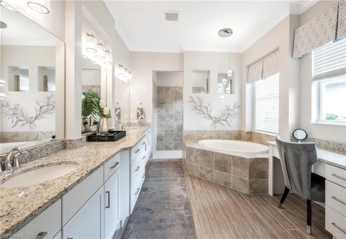 Bathroom with vanity, ornamental molding, and shower with separate bathtub I love the make-up vanity