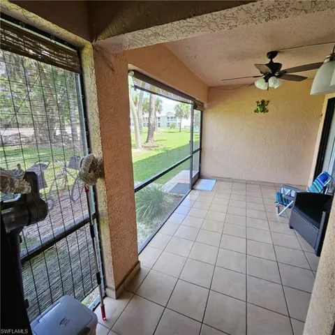 Sunroom featuring ceiling fan