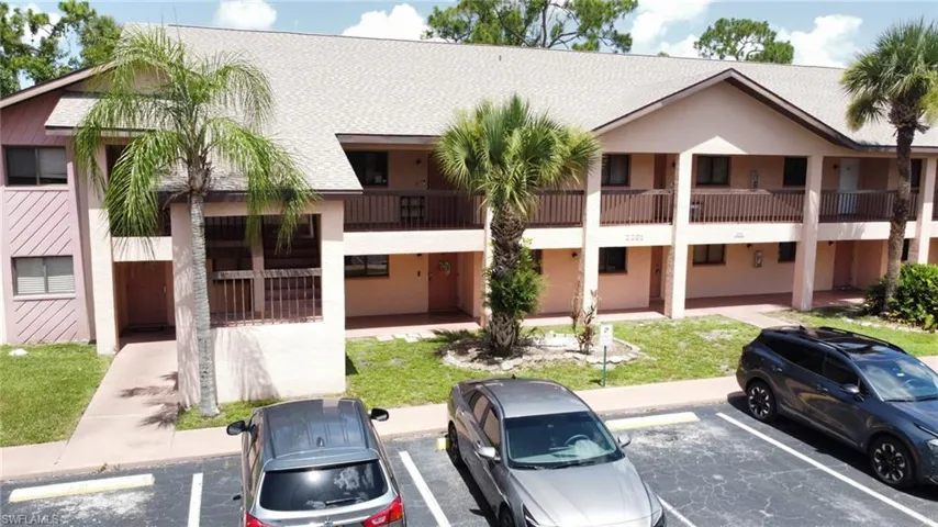 Multi unit property featuring a balcony