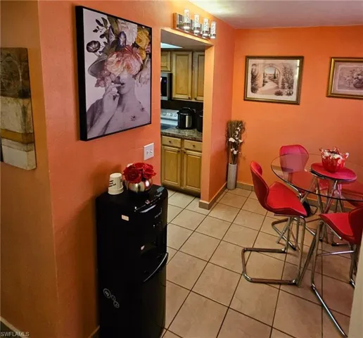 Dining room with light tile patterned floors