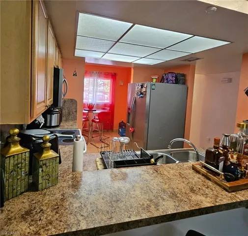 Kitchen with stainless steel appliances and light tile patterned floors