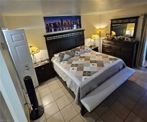 Bedroom featuring light tile patterned flooring