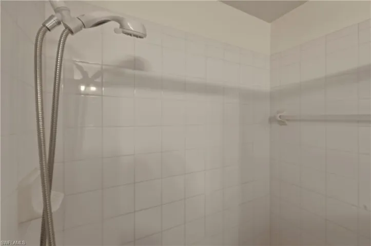 Full bath featuring a tile shower