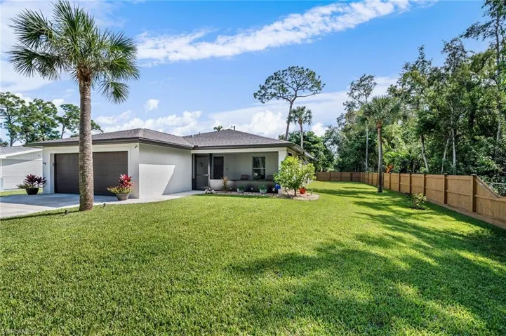 Front View with privacy fence and preserve
