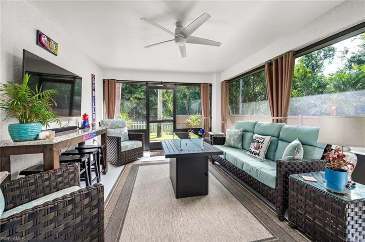 Sunroom / solarium featuring ceiling fan and a wealth of natural light