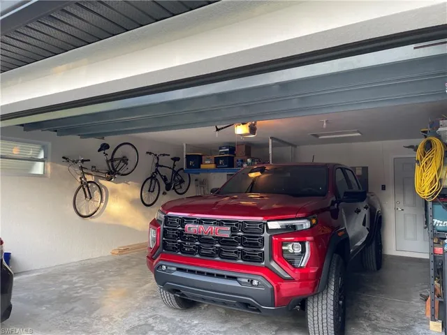 Garage featuring a garage door opener