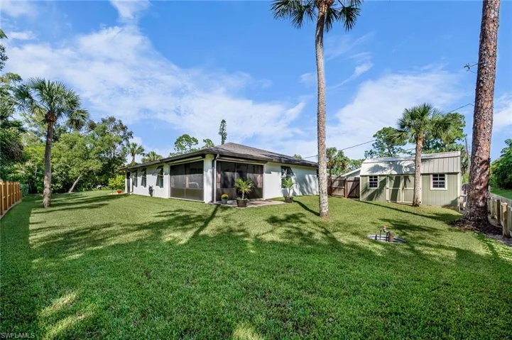 View of yard with a sunroom