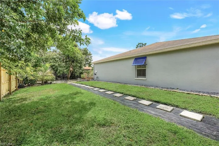 Large fenced in yard to the left of the home.