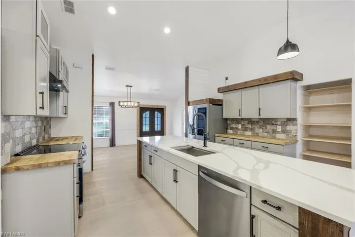 Kitchen is open to dining room.