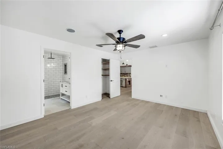 Large primary suite is located off the living room.