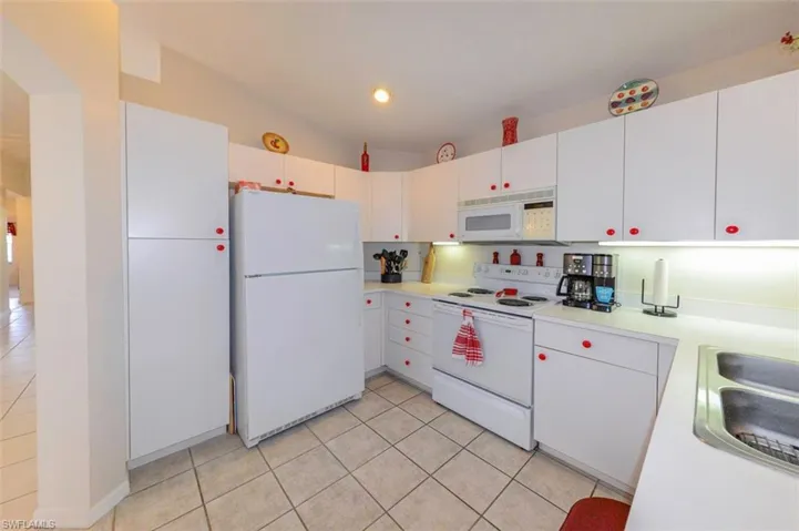 The contemporary white kitchen....